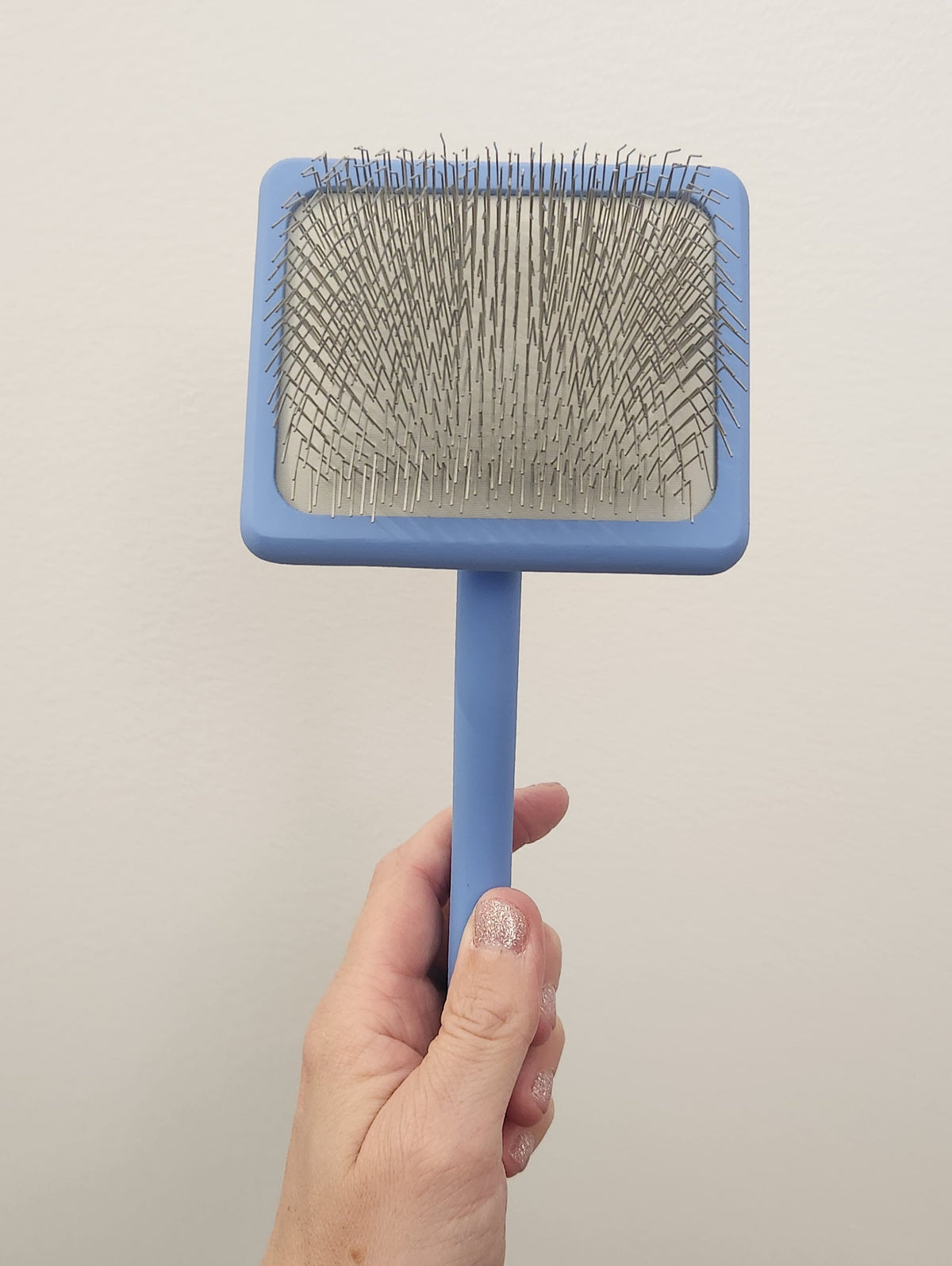 Brosse ferme pour chiens et chats Slicker