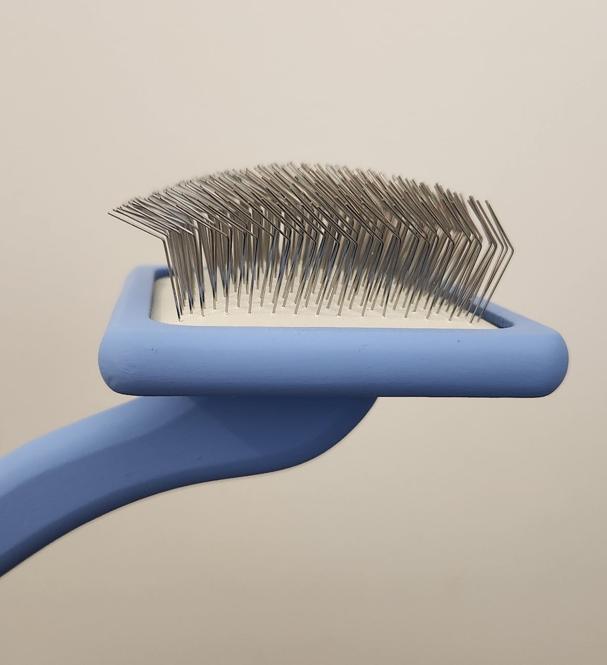 Brosse ferme pour chiens et chats Slicker